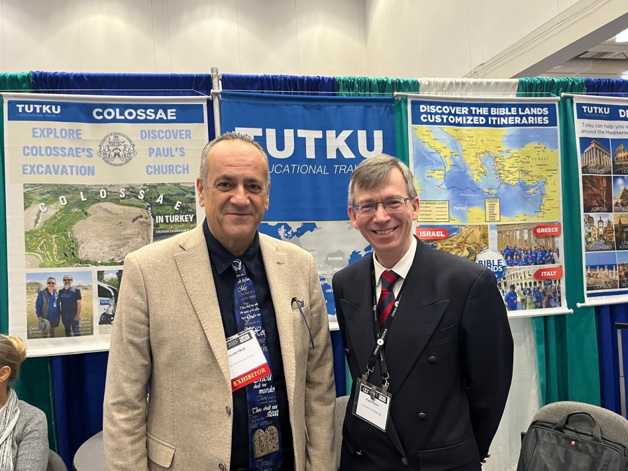 Polycarp Speaker Paul Foster Visits Tutku Tours Booth at SBL Boston